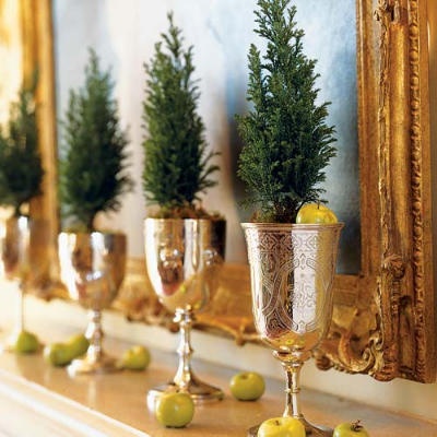 Southern Living has 102 great design inspirations for your home! I love this idea of mini christmas trees used in mint julip cups on the mantel. ADORE!